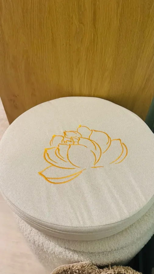 Stack of cream meditation cushions photographed by a verified buyer